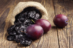 Bone Health ~ Topical Tips Prunes with plums in small sack on old wooden table
