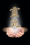Reiki Kanji Symbol above cupped hands showing white light healing energy