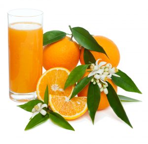 Orange juice and fruits with blossom and leaves isolated on white background - a source of potassium to combat muscle cramping