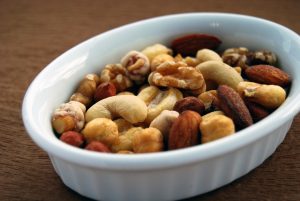 a bowl of mixed nuts - a source of magnesium that helps prevent cramps