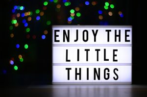 A sign with the words, "Enjoy the Little Things" Gratitude for small things turns them into Big Things!